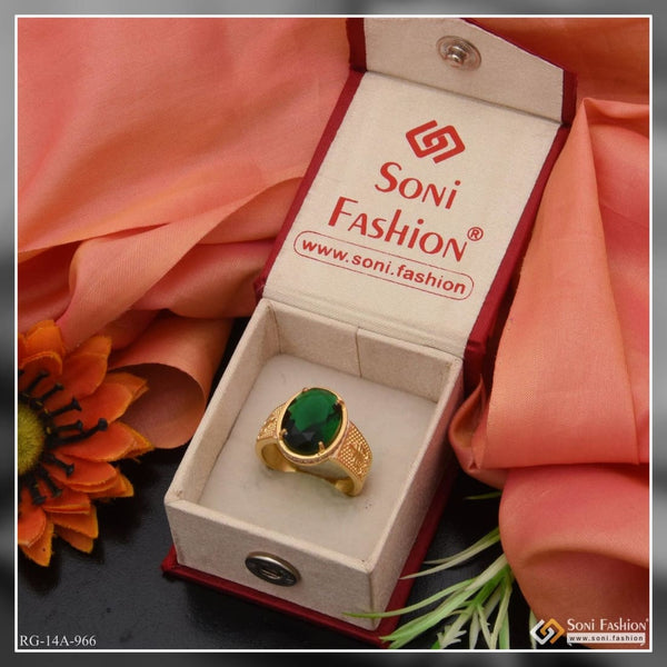 Premium Photo | A gold ring with a green stone and gold ring.