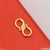 1 Gram Gold Plated S Hook for Chain displayed on red cloth