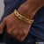 Fashionable design black and golden color bracelet with man wearing gold bracelet with red stone
