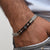 Attention-getting design silver & black color bracelet for