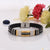 Stylish men’s bracelet with black leather and gold plated clasp