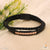 Black and golden leather braided bracelet with white