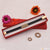 Red velvet box with gold buckle and flower accessory for Diamond Gold Plated Rubber Bracelet.