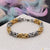 Stainless steel bracelet with etched design in golden and silver colors