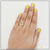 Woman’s hand with yellow nails and gold plated ring, style LRG-126