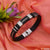 Eye-catching high-quality black leather bracelet with silver clasp.