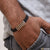 Man wearing black bracelet with gold squares - Finely Detailed Design Rose Gold Bracelet For Men