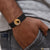 Man wearing gold plated bracelet with black band - Horse In Round With Diamond Finely Detailed Design (Style B697)