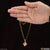 Fashion-forward lady holding gold plated necklace with diamond from Style A360