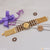 Gold watch with purple ribbon on Om With Diamond Gorgeous Design Gold Plated Rudraksha Bracelet - Style B798