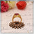 Owal shape red stone with diamond artisanal design gold