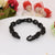 Black braid bracelet with flower - Ring Into Ring Attention Bracelet
