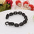 High-quality black braid bracelet on white plate - Ring Into Ring Style B555