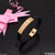 Gold plated rubber bracelet with pink bow and ribbon - finely detailed design