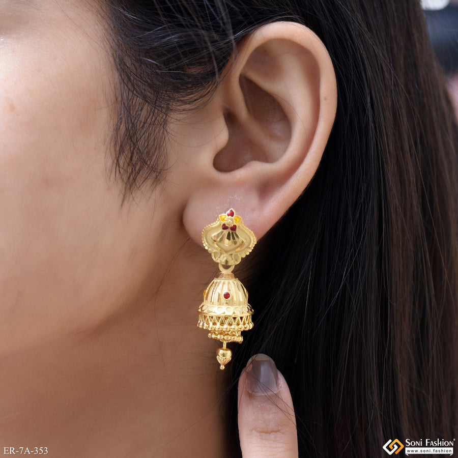 Soni Fashion gold-plated traditional jhumka drop earrings with intricate bell-shaped design worn on a woman's ear