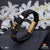 Stylish dual string black leather wrap with golden pattern