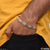 Man wearing gold bracelet with diamond clasp from Zig-zag Classic Design B412
